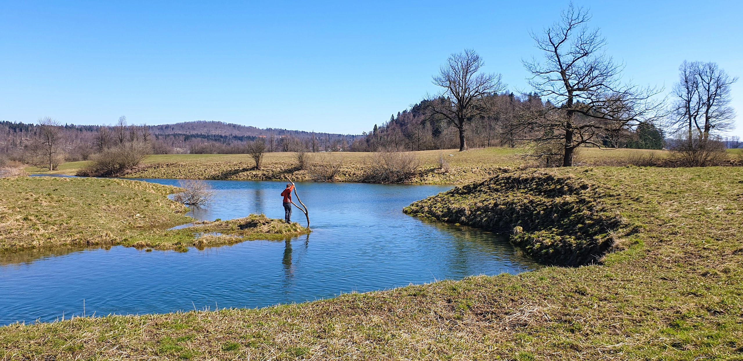 Angler fishing on a sunny river