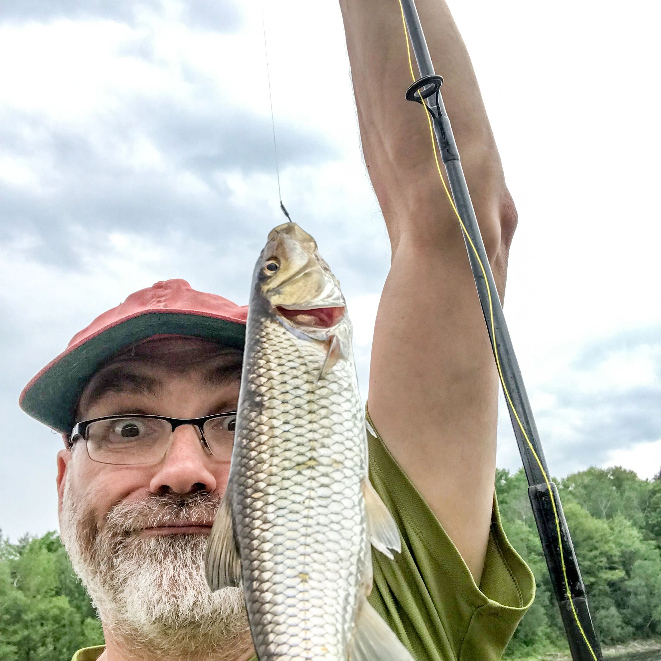 Angler portrait holding a fish